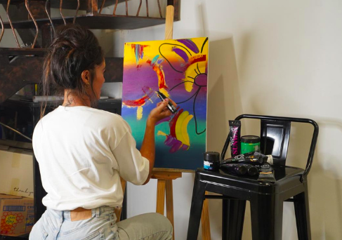 Anya Minko painting live during a public art session